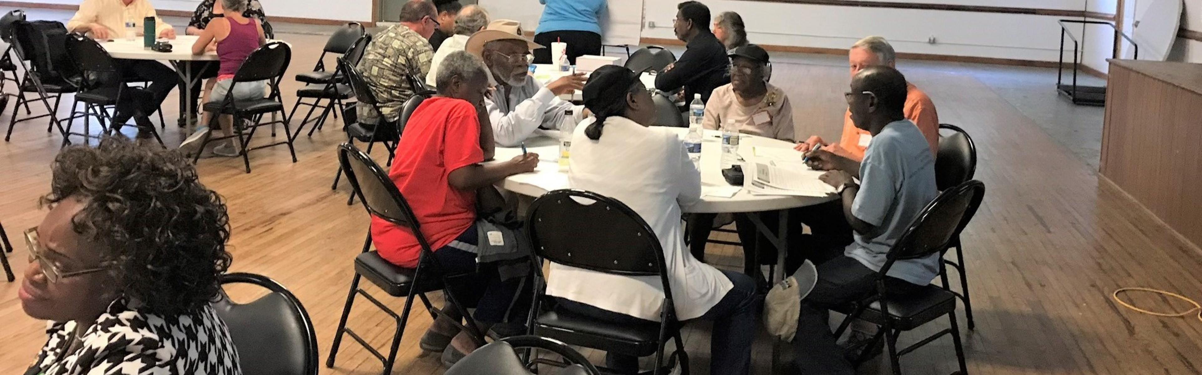 New Bern community meeting with residents sitting around tables